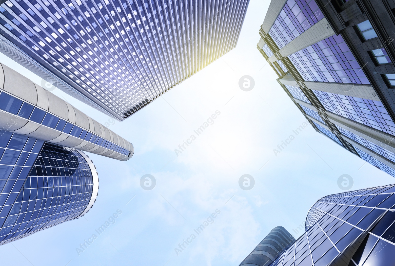 Image of Office buildings with tinted windows, low angle view. Modern architectural corporation 