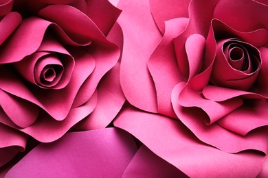 Photo of Beautiful flowers made of paper as background, top view