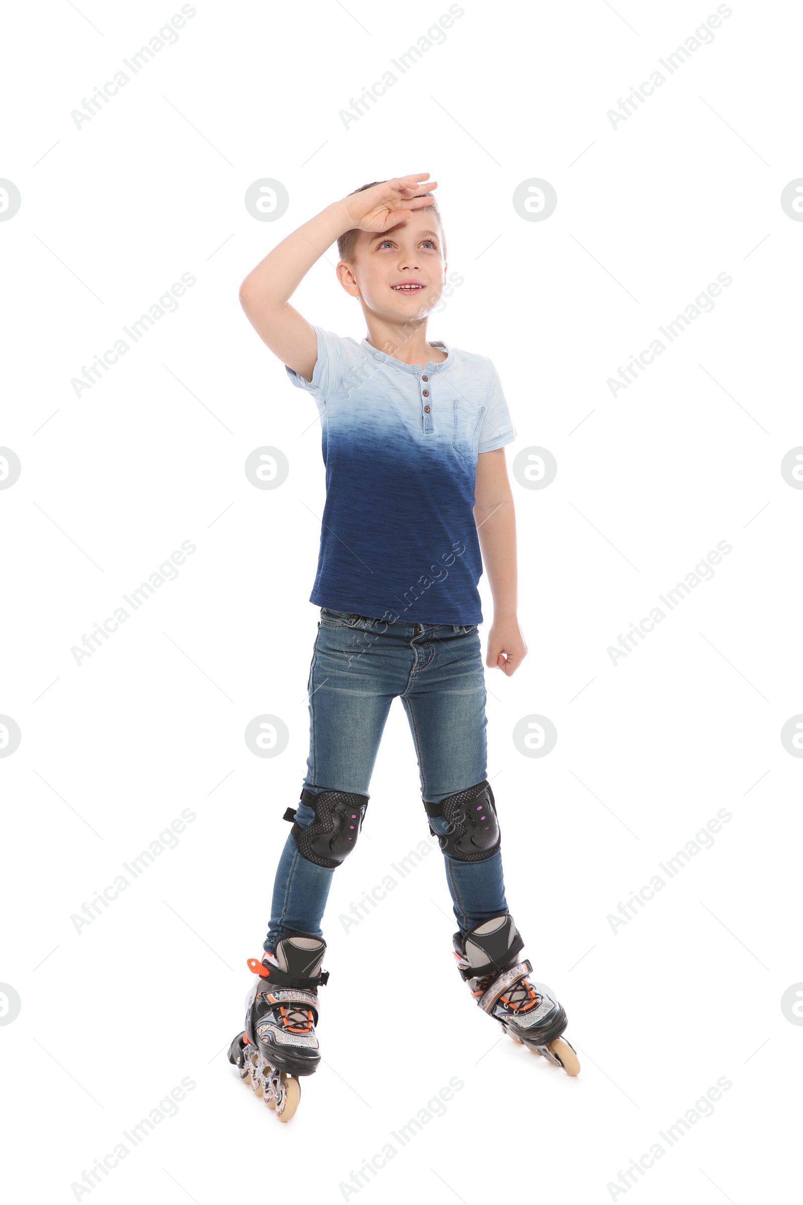 Photo of Little boy with inline roller skates on white background