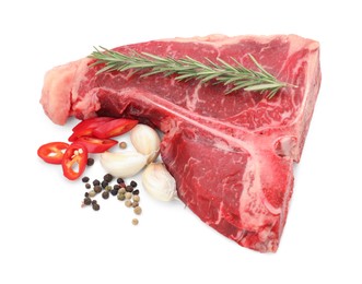 Raw t-bone beef steak and spices isolated on white