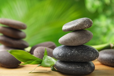 Photo of Composition with stones on table against blurred background. Zen concept