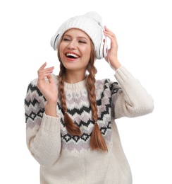 Photo of Young woman listening to music with headphones on white background