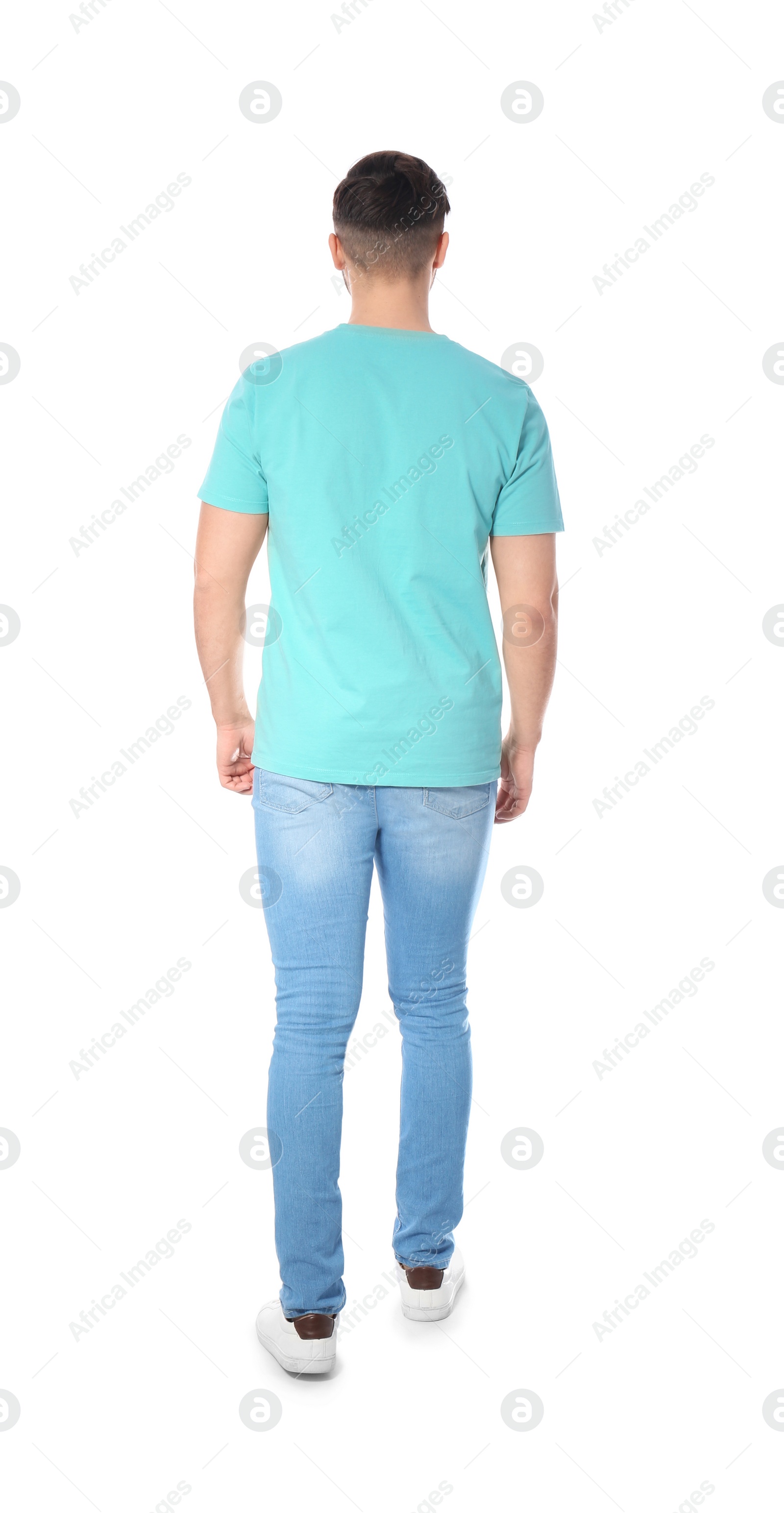 Photo of Young man in casual clothes posing on white background