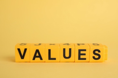 Photo of Blocks with word VALUES on yellow background
