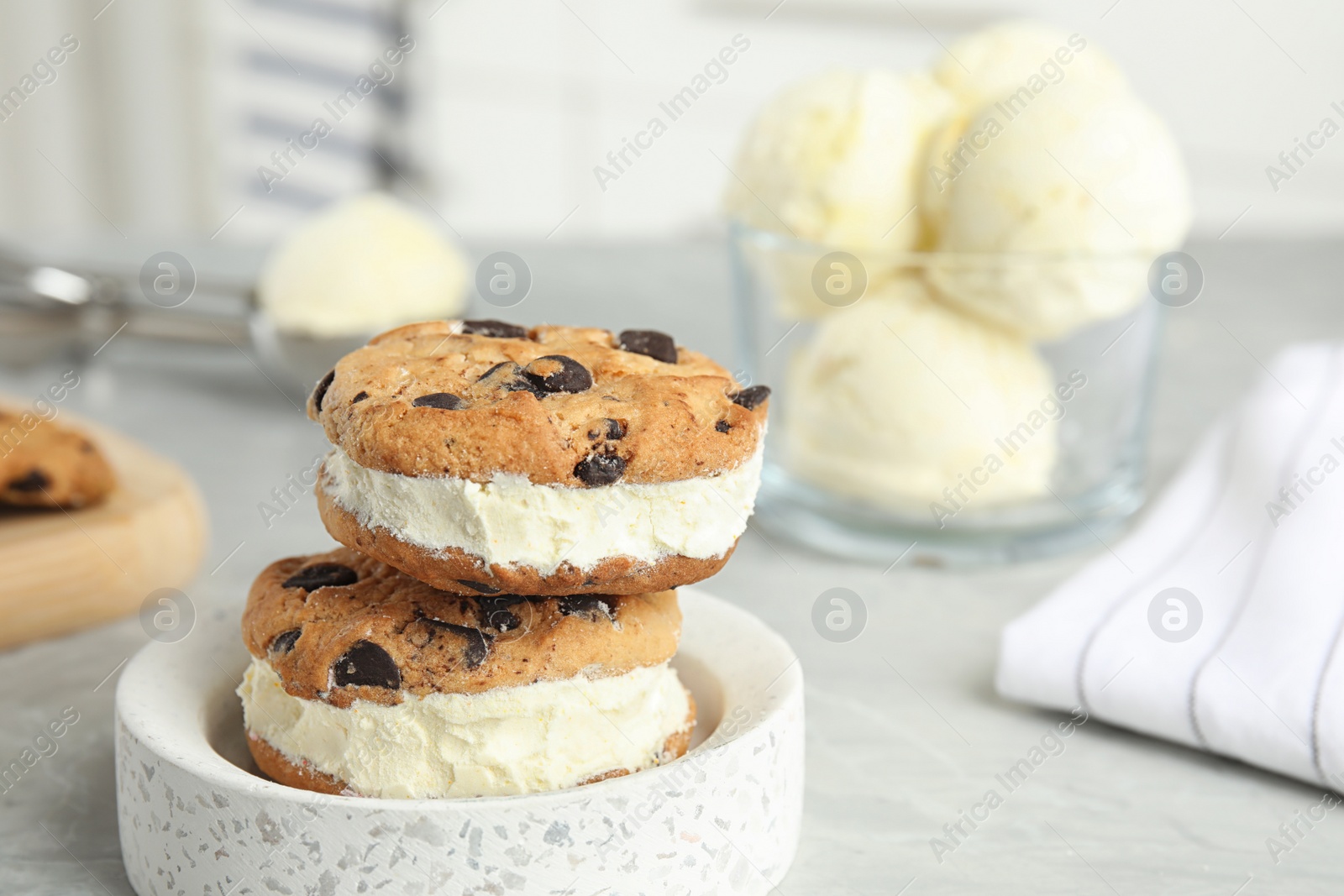 Photo of Sweet delicious ice cream cookie sandwiches on table, space for text