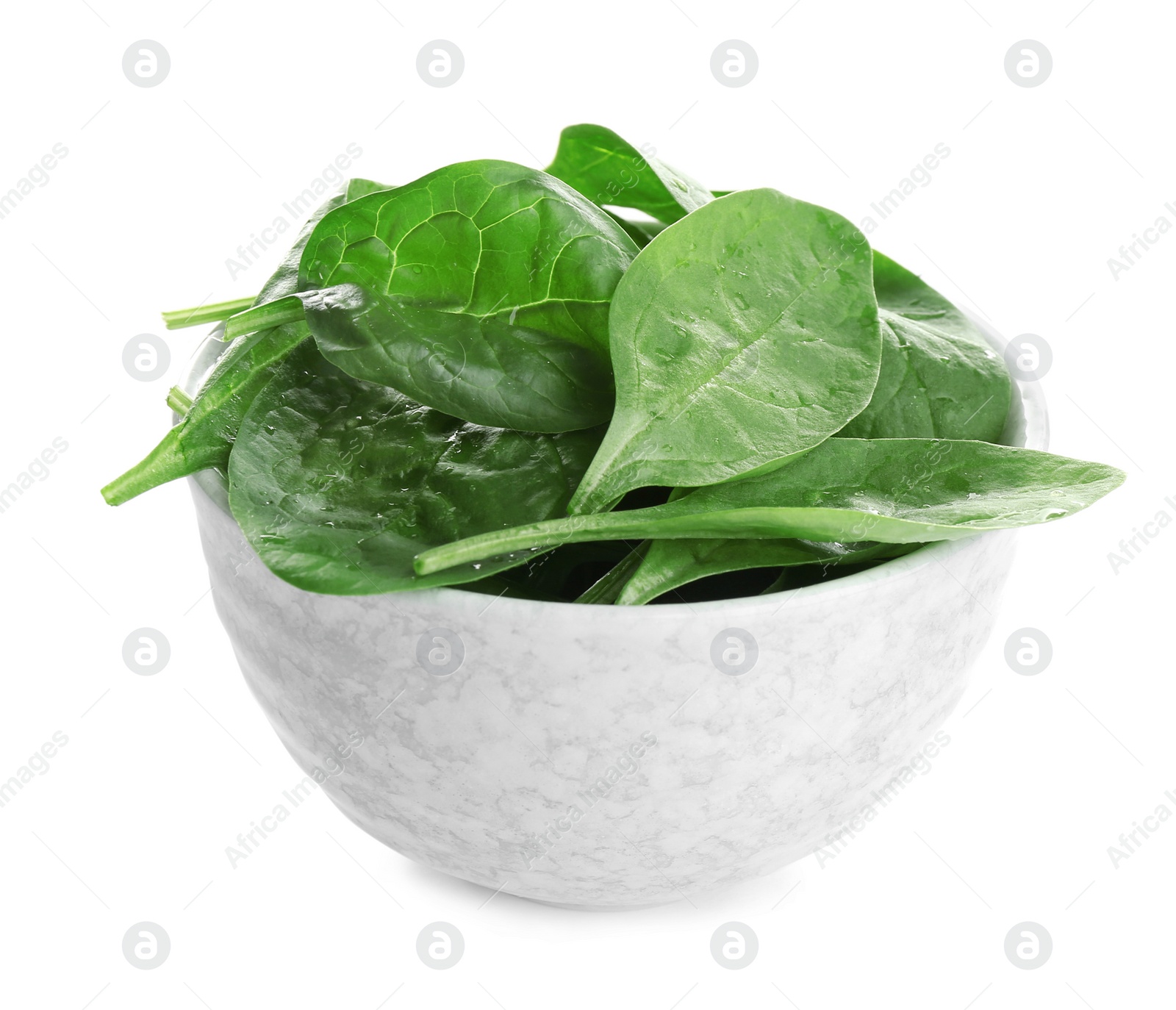 Photo of Fresh green healthy baby spinach leaves in ceramic bowl isolated on white