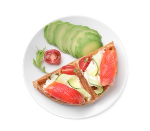 Photo of Delicious Belgian waffle with salmon, avocado, cream cheese and vegetables on white background, top view