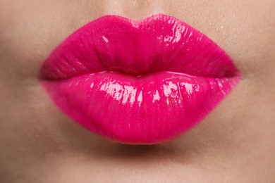 Closeup view of beautiful woman puckering lips for kiss