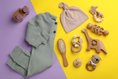 Flat lay composition with baby clothes and accessories on color background