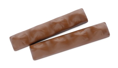 Sweet tasty chocolate bars on white background, top view