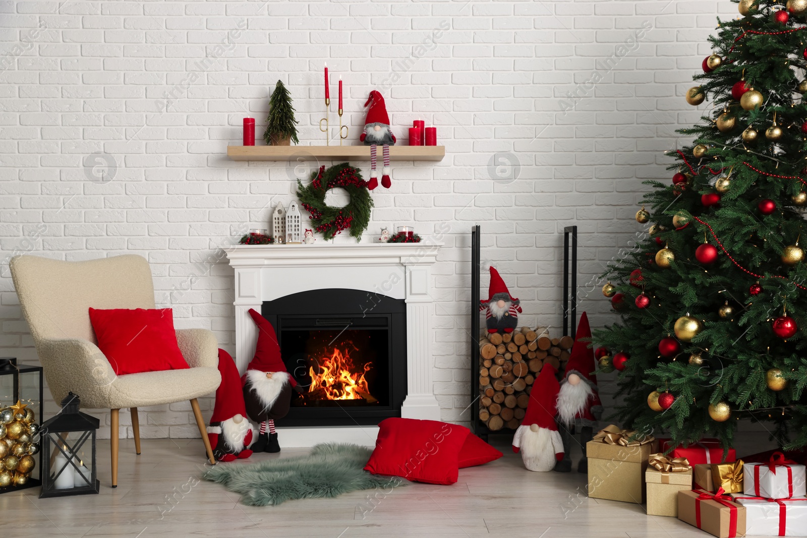 Photo of Beautiful Christmas themed photo zone with tree and fireplace in room