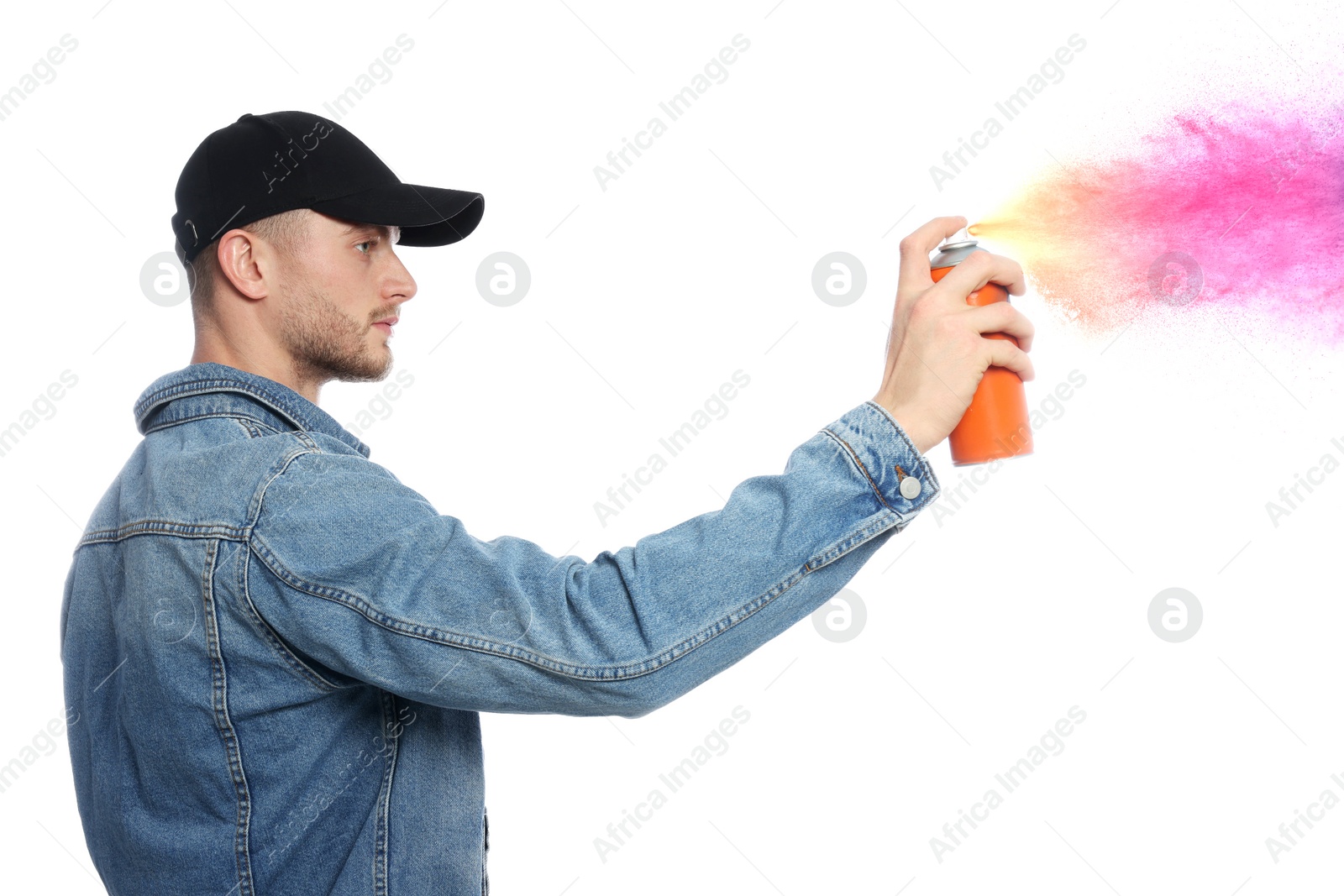 Image of Handsome man spraying paint against white background