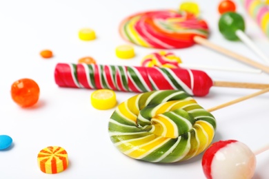 Many different candies on white background, closeup view