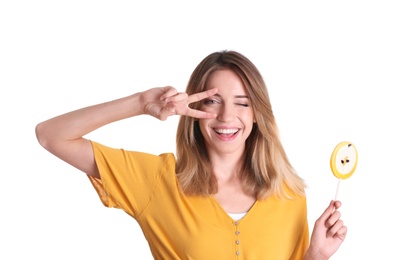 Photo of Young pretty girl with candy on white background