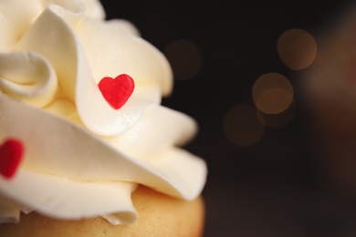 Tasty sweet cupcake on blurred background, closeup view with space for text. Happy Valentine's Day