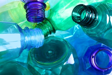 Photo of Used plastic bottles as background, closeup. Recycling problem