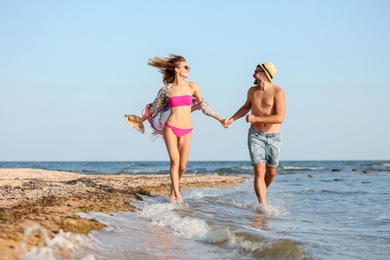 Young couple spending time together on beach
