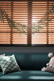 Stylish room decorated with beautiful eucalyptus garland