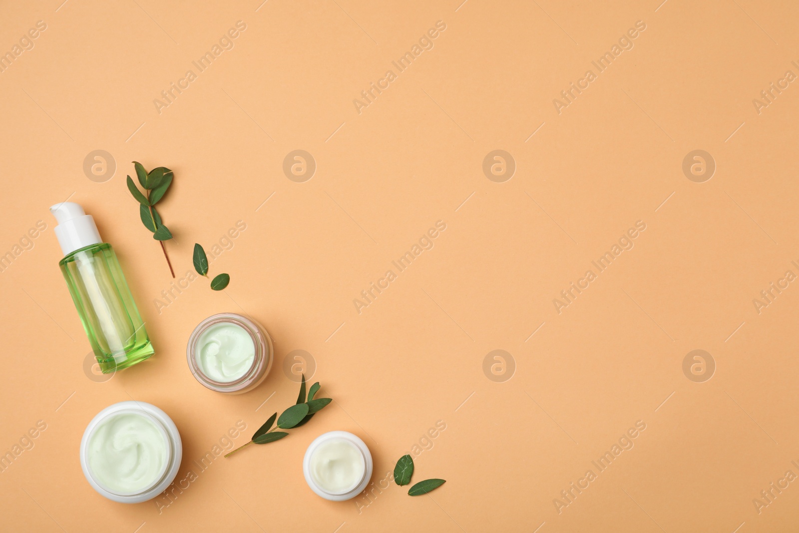 Photo of Flat lay composition with cosmetic products on color background