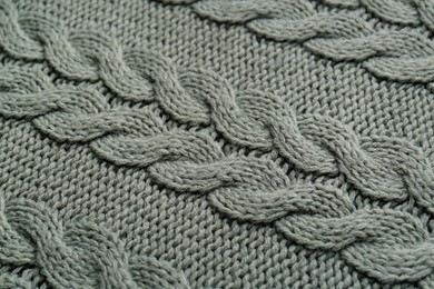 Knitted fabric with beautiful pattern as background, top view