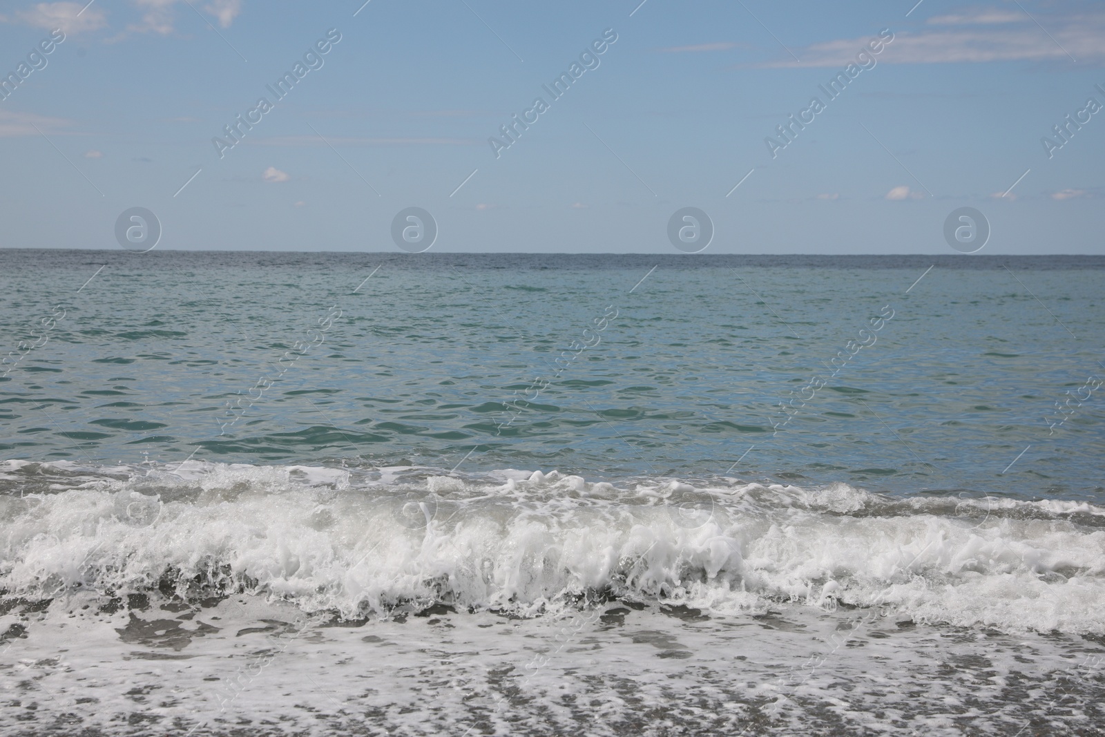 Photo of Picturesque view of beautiful sea shore under blue sky
