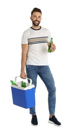 Photo of Happy man with cool box and bottles of beer on white background