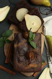 Photo of Flat lay composition with tasty pear bread on black table. Homemade cake