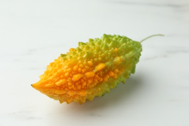 Bitter melon on white marble table, closeup