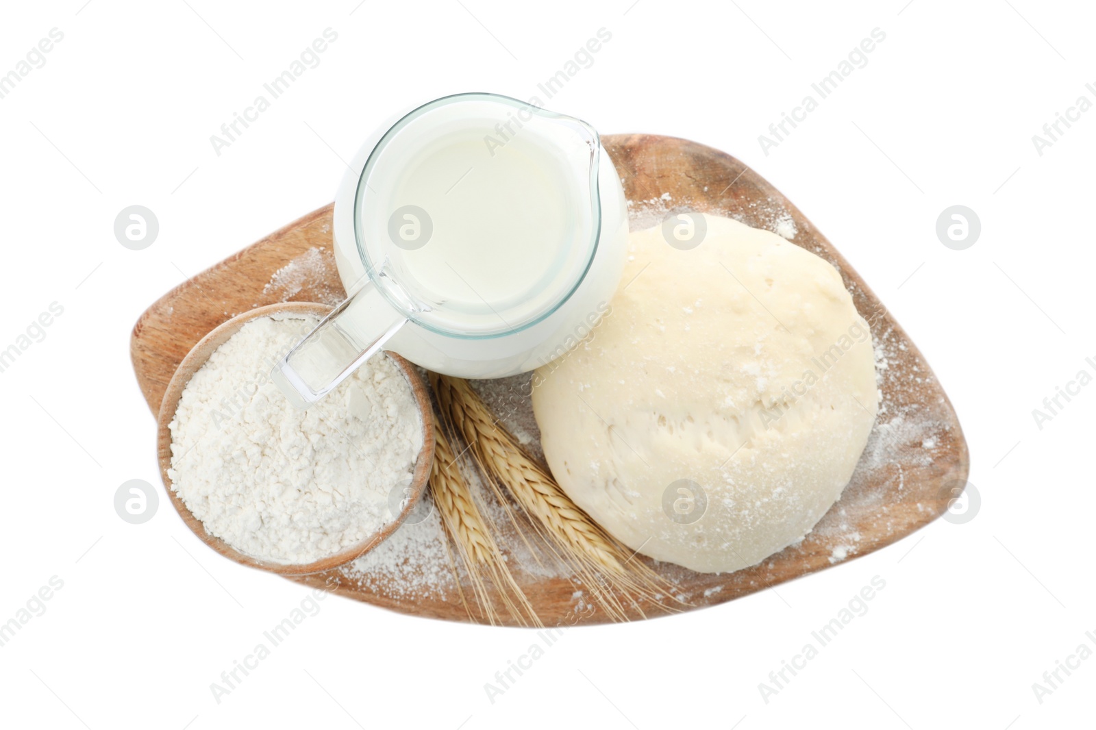 Photo of Board with dough, milk and flour on white background, top view. Cooking pastries