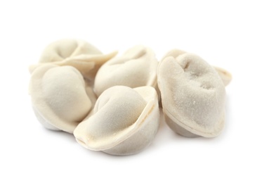 Photo of Pile of raw dumplings on white background