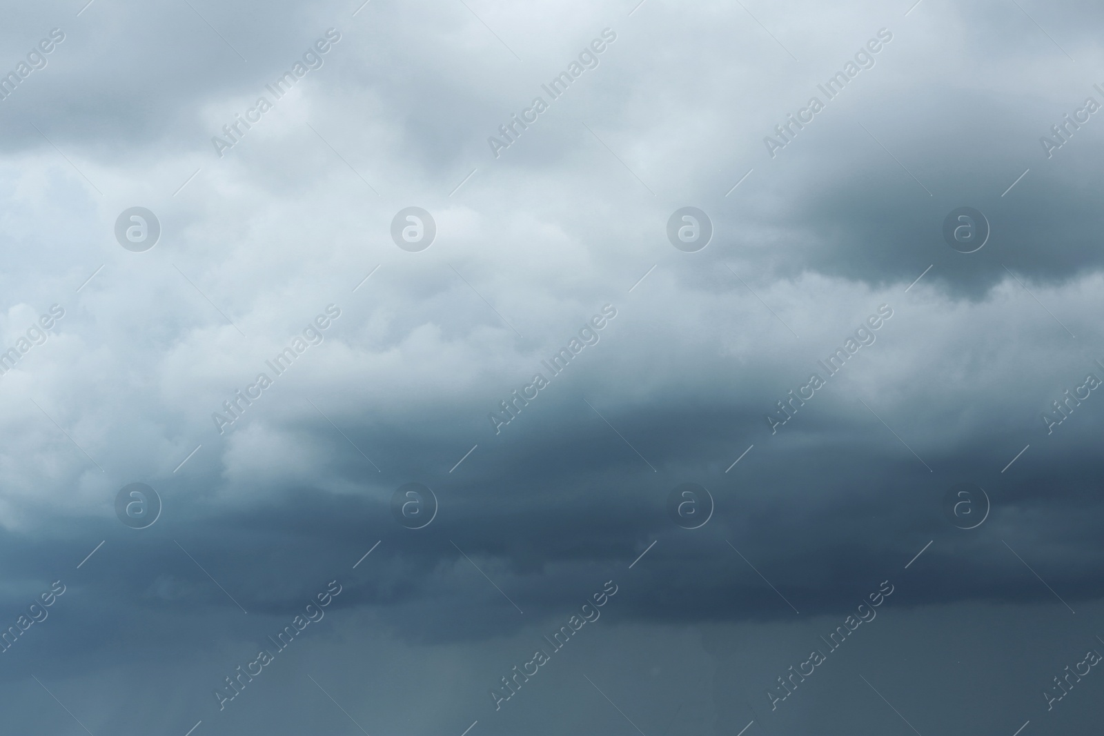 Photo of Sky with heavy rainy clouds on grey day