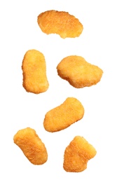 Image of Fresh chicken nuggets falling on white background