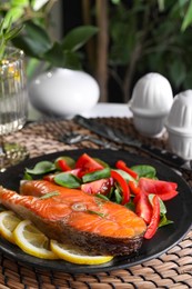 Healthy meal. Tasty grilled salmon with vegetables and lemon served on table, closeup