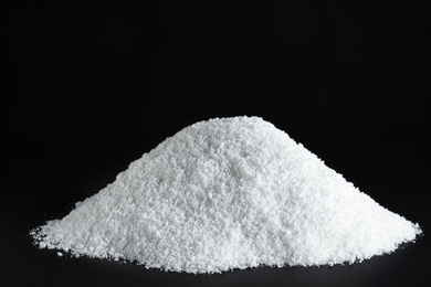 Photo of Heap of white snow on black background