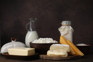 Different fresh dairy products on wooden table