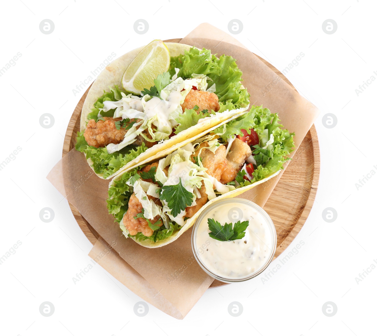 Photo of Yummy fish tacos with sauce isolated on white, top view