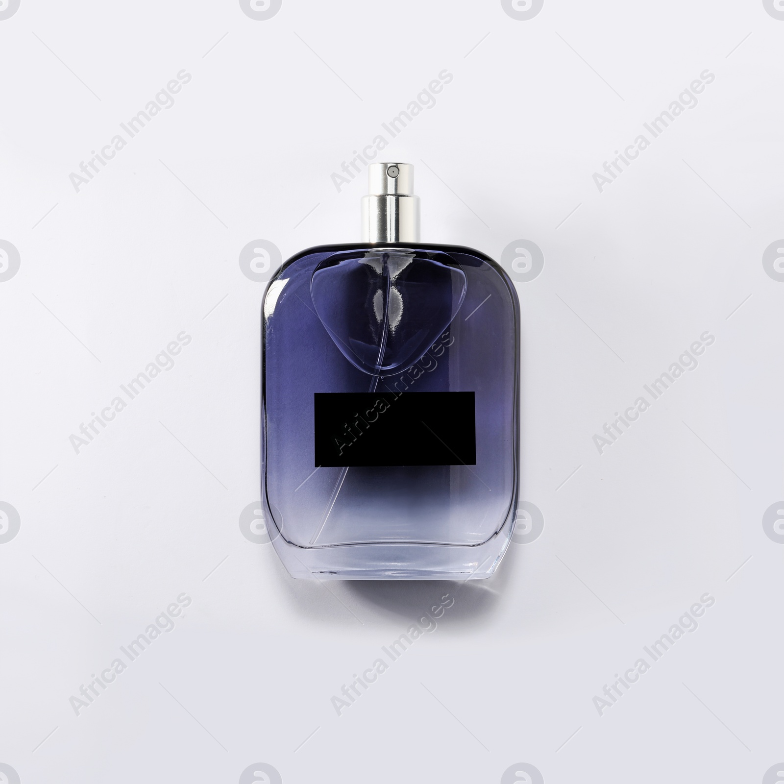 Photo of Luxury men`s perfume in bottle on white background, top view