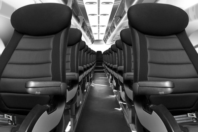 Image of Modern airplane cabin with comfortable seats 