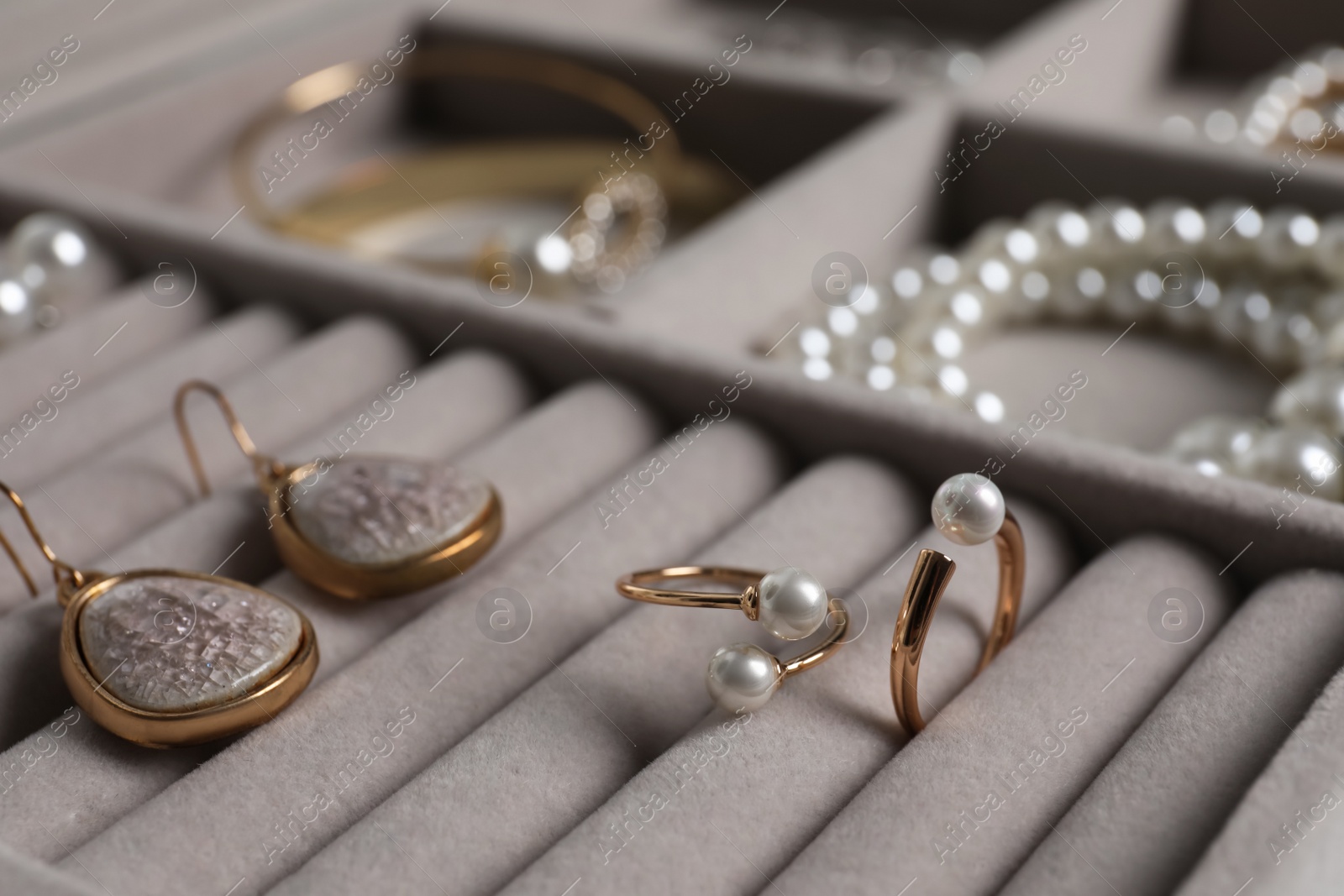 Photo of Box with luxurious pearl jewelry, closeup view