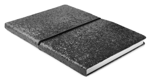 Photo of Stylish black glitter notebook isolated on white