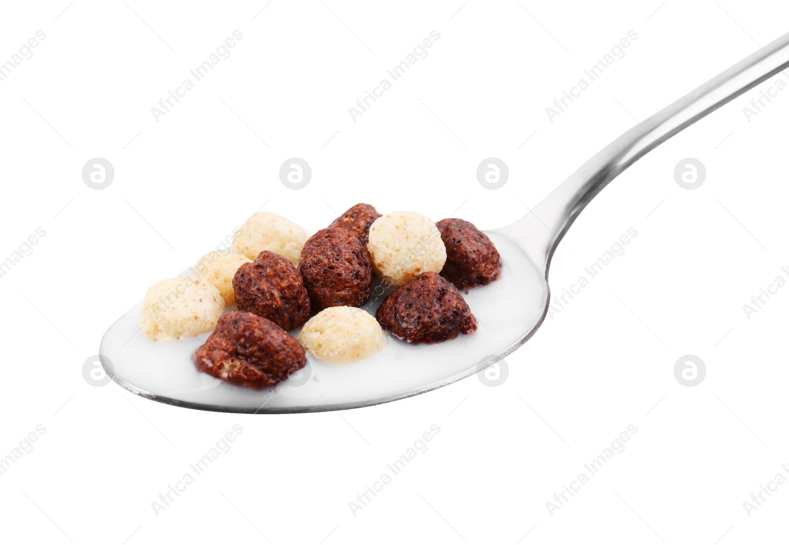 Photo of Cereal balls and milk in spoon isolated on white