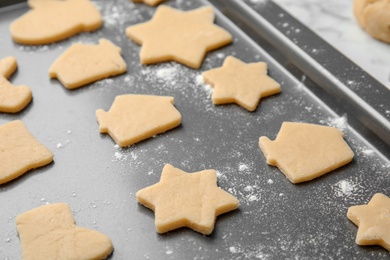 Photo of Raw Christmas cookies on baking tray