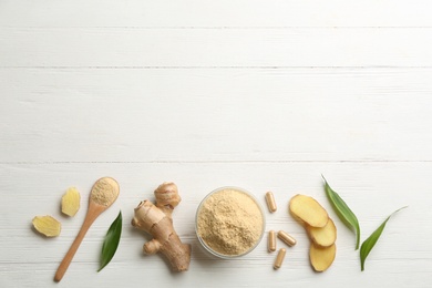 Photo of Flat lay composition with fresh and dry ginger on white wooden table. Space for text