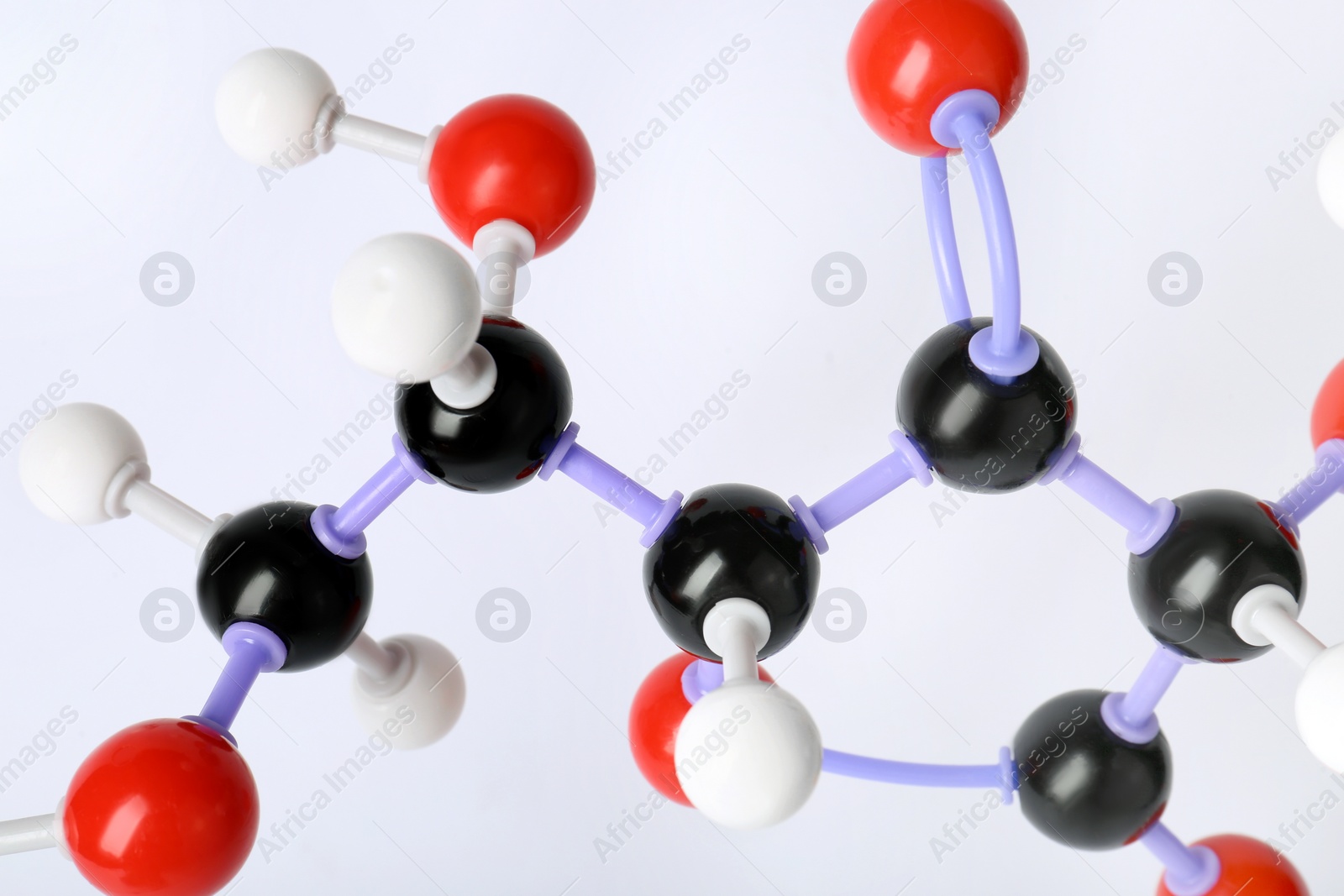 Photo of Molecule of vitamin C on white background, closeup. Chemical model