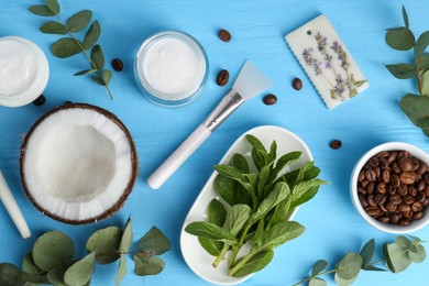 Flat lay composition with homemade cosmetic products and fresh ingredients on light blue wooden table