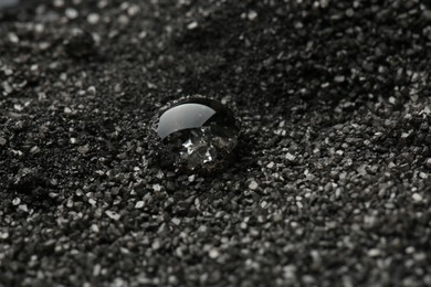 Beautiful gemstone for jewelry on decorative black sand