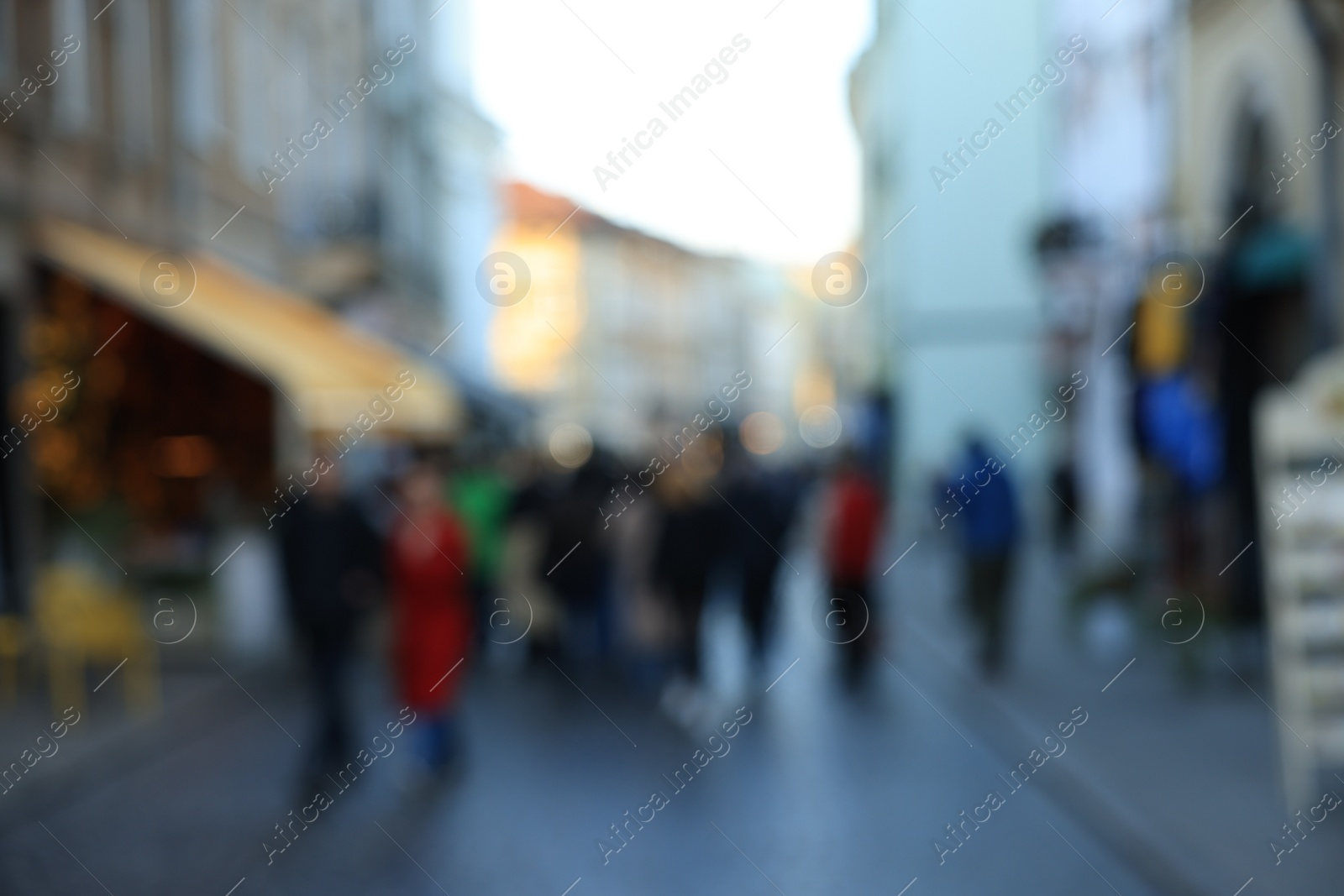 Photo of Blurred view of people walking on city street