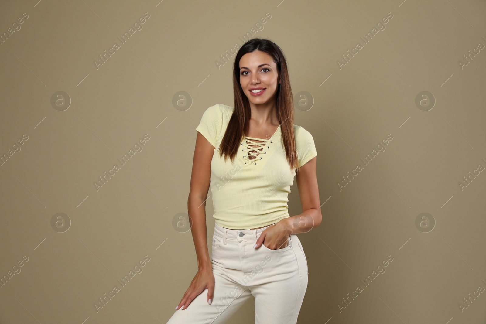 Photo of Portrait of beautiful woman on beige background