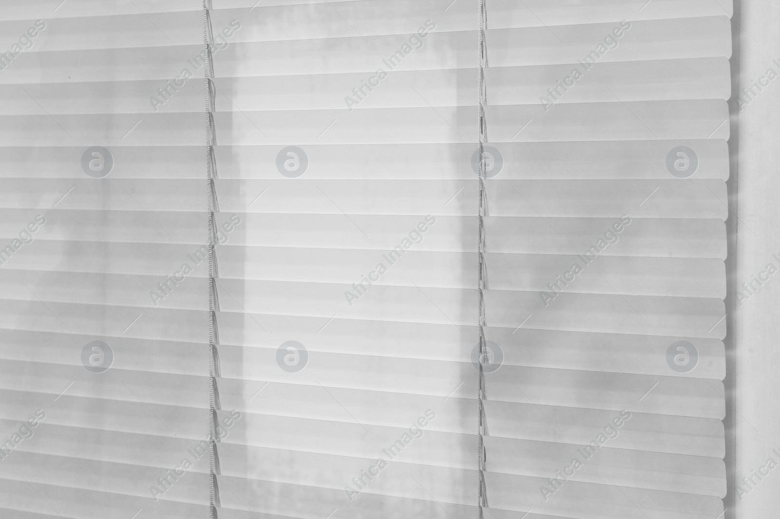 Image of Window with dirty and clean blinds, closeup 