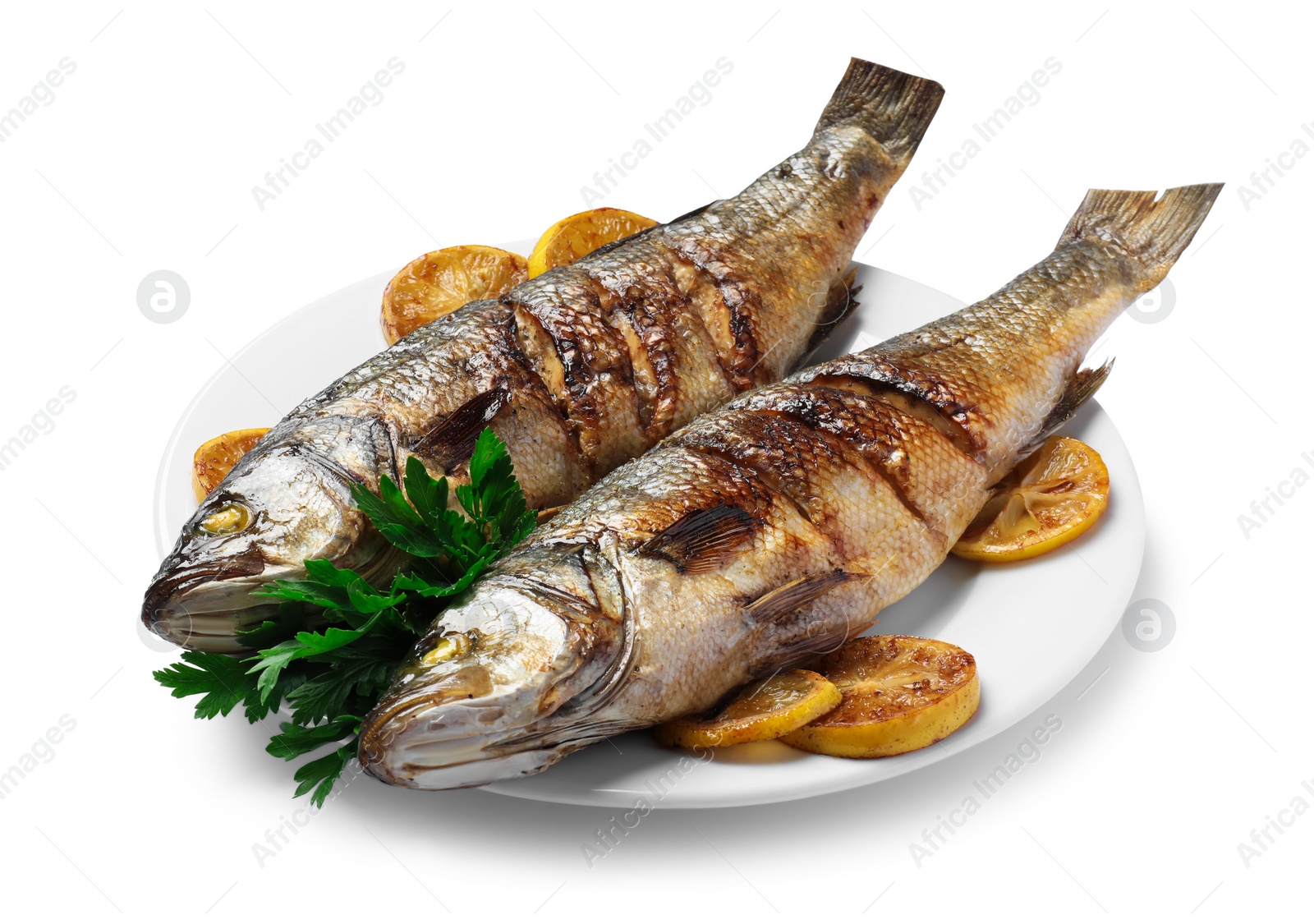 Photo of Plate with delicious sea bass fish, lemon and parsley isolated on white